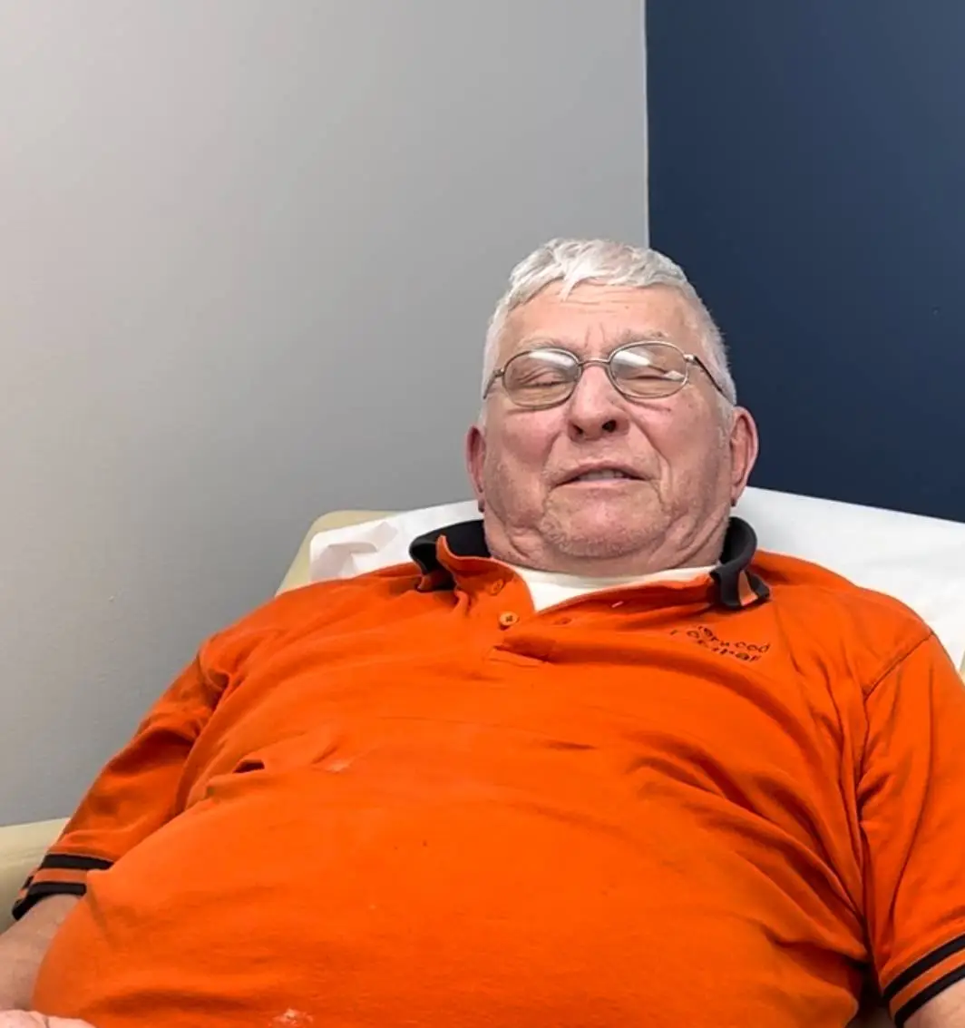 Neuropathy patient relaxing during treatment in Appleton