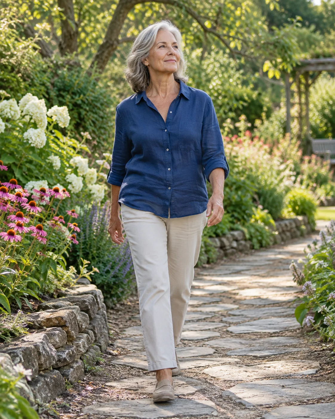 Illustrative lifestyle image of an older woman taking a relaxed garden walk